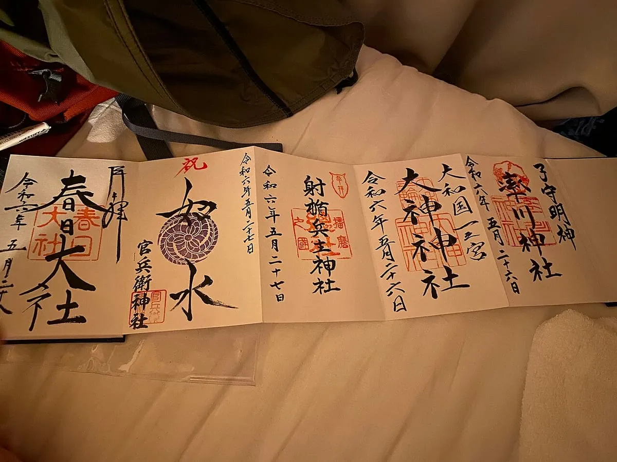 A goshuincho with five hand-brushed goshuin seals