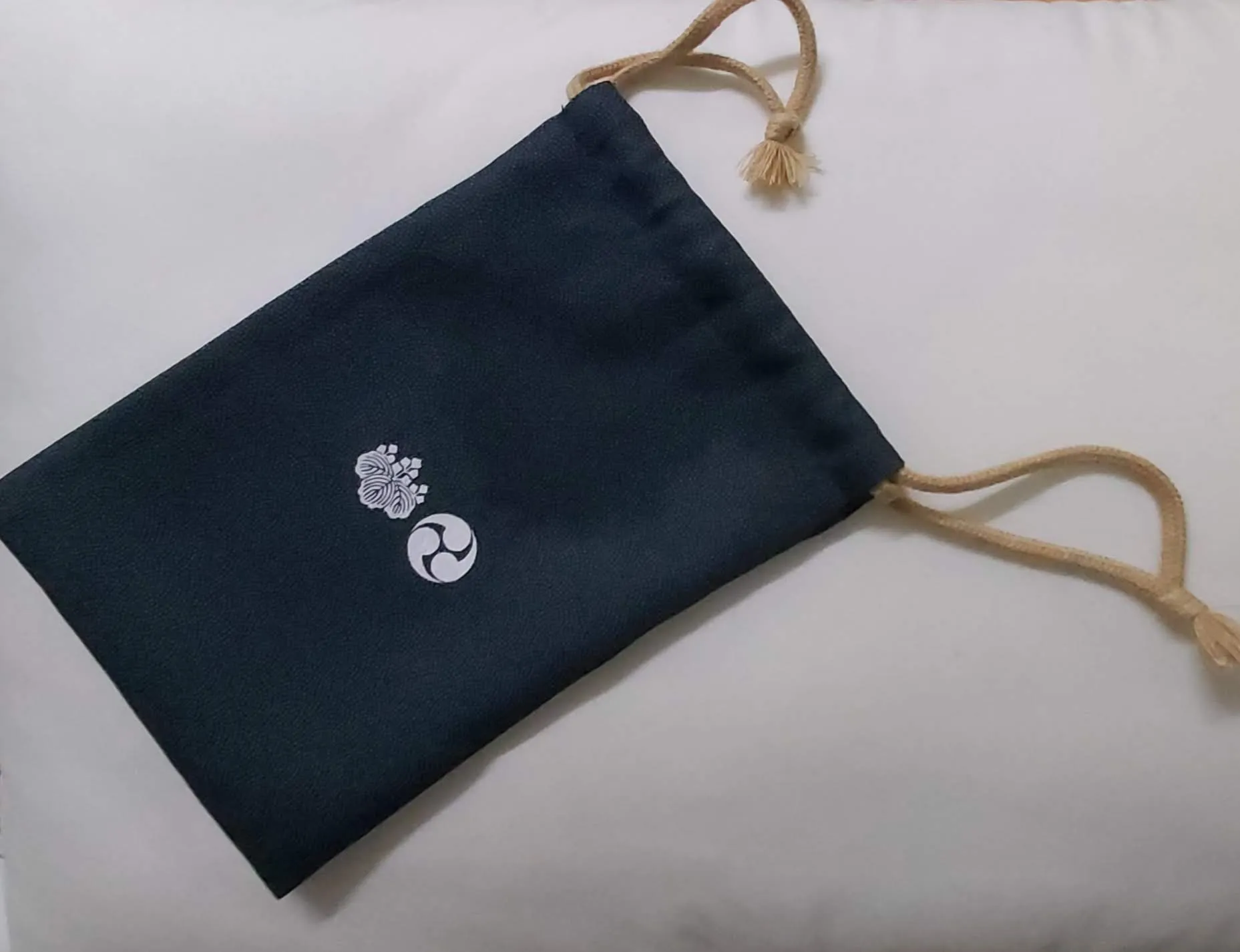 A red drawstring bag for a goshuincho
