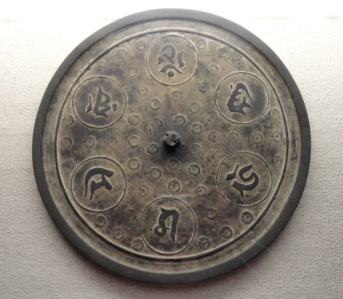 Bronze mirror in the Treasure Hall of Itsukushima Shrine, Miyajima, Hiroshima Prefecture