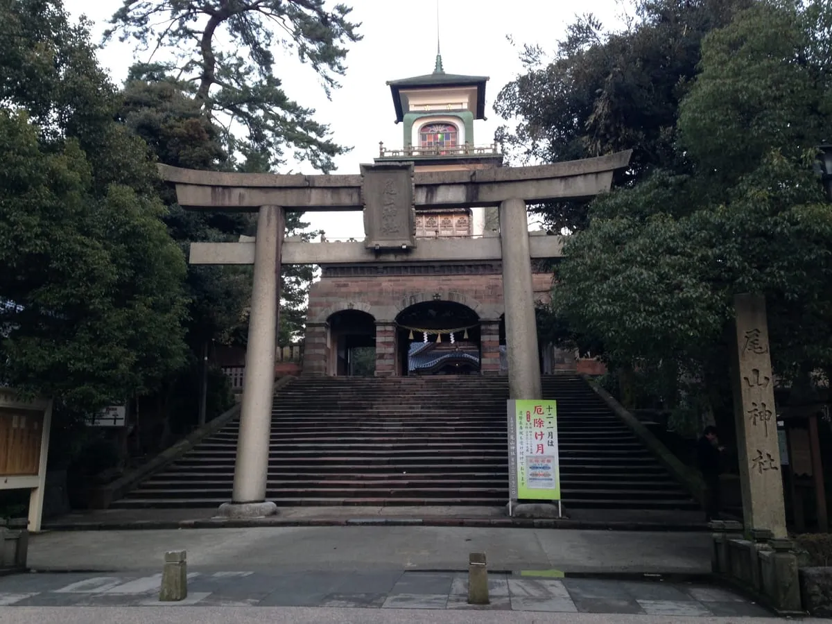 The Shinmon gate of Oyama Jinja — a three-story structure blending Japanese, Chinese, and Western architecture, with stained glass on the top floor